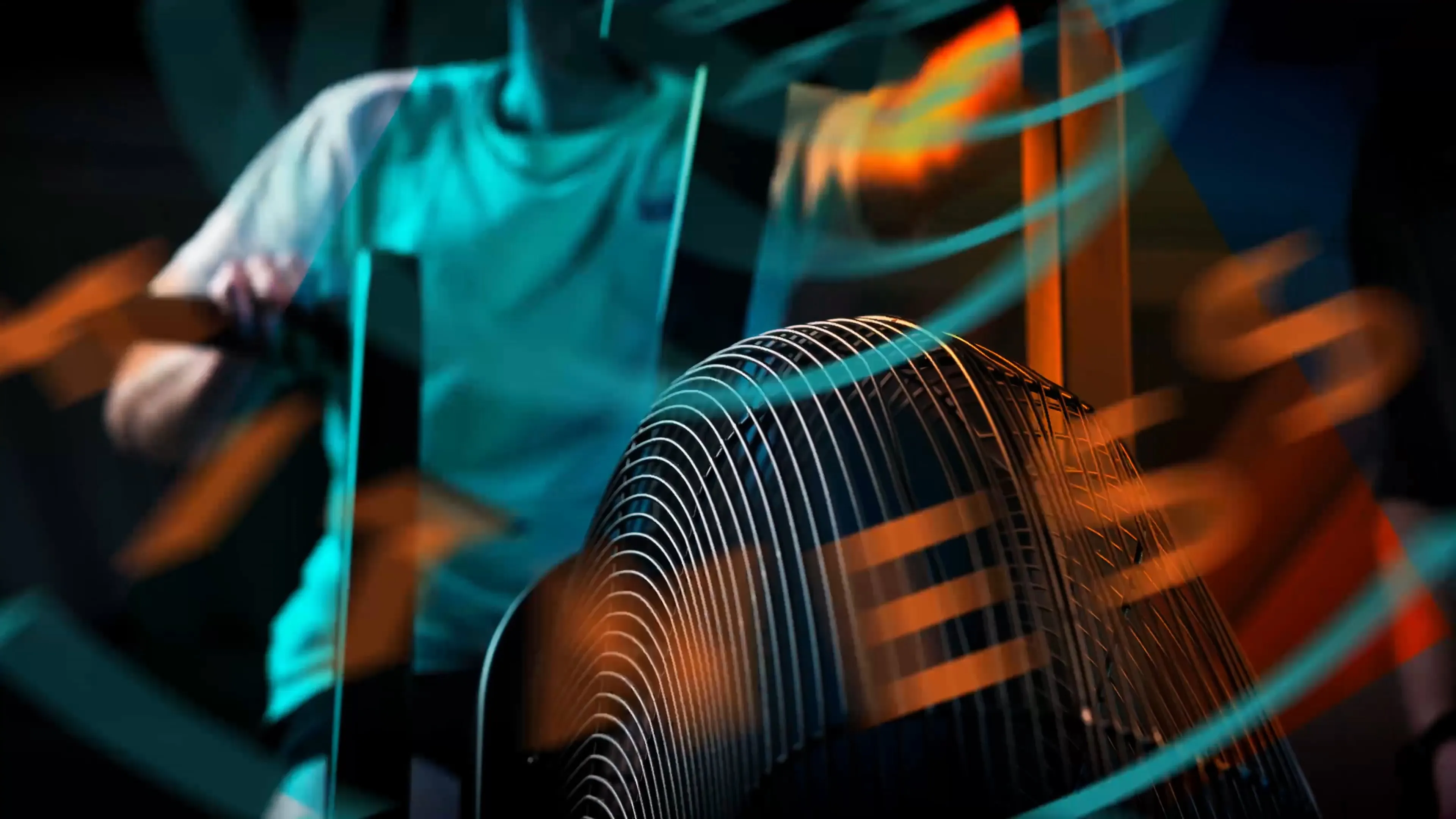 Still from a West Coast Fitness brand video produced by DotPerformance, showing a motion graphic passing across the frame with light trails and movement blur